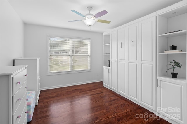 4500 Carrington Dr, Lancaster, SC 29720 - unfurnished bedroom featuring dark wood-type flooring, baseboards, a closet, and a ceiling fan