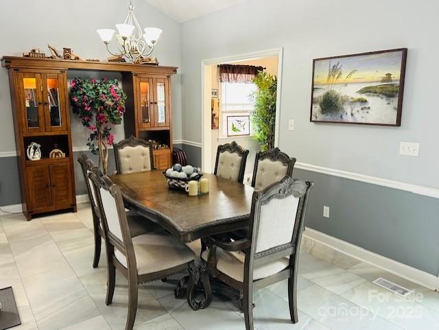 111 Brookview Dr, Shelby, NC 28152 - dining room with a chandelier and vaulted ceiling