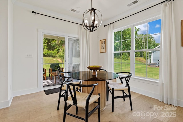 433 Sinaloa St, Waxhaw, NC 28173 - dining space with a chandelier, plenty of natural light, baseboards, and light wood finished floors