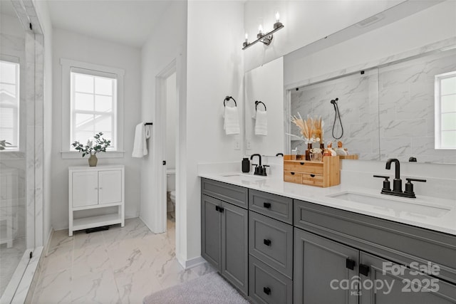 433 Sinaloa St, Waxhaw, NC 28173 - full bath with marble finish floors, double vanity, plenty of natural light, and toilet
