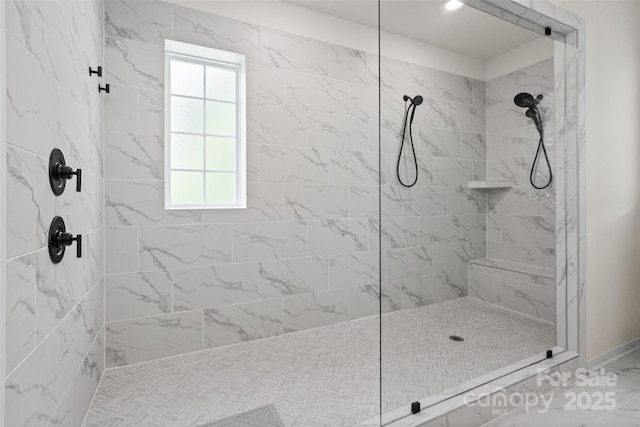 433 Sinaloa St, Waxhaw, NC 28173 - bathroom featuring a tile shower, healthy amount of natural light, marble finish floors, and baseboards