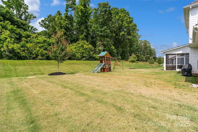 433 Sinaloa St, Waxhaw, NC 28173 - view of grassy yard with a playground and a sunroom