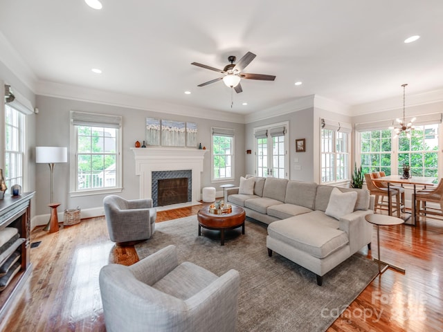1600 Princeton Ave, Charlotte, NC 28209 - living area featuring a fireplace with flush hearth, wood finished floors, ceiling fan, a chandelier, and recessed lighting