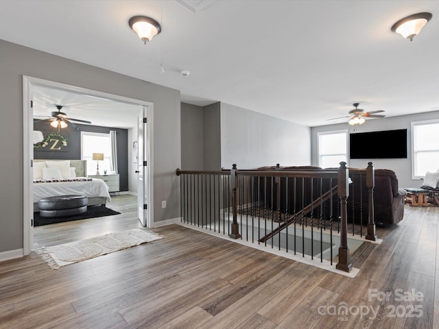 1810 Kerwick Ct, Lancaster, SC 29720 - hall featuring an upstairs landing, wood finished floors, and baseboards