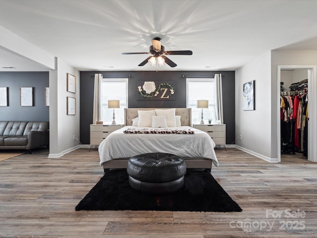 1810 Kerwick Ct, Lancaster, SC 29720 - bedroom with baseboards, wood finished floors, a spacious closet, and multiple windows