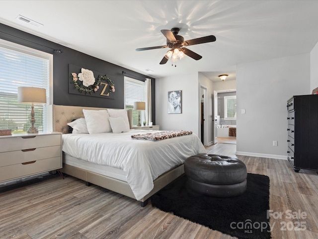 1810 Kerwick Ct, Lancaster, SC 29720 - bedroom featuring wood finished floors, multiple windows, a ceiling fan, and connected bathroom
