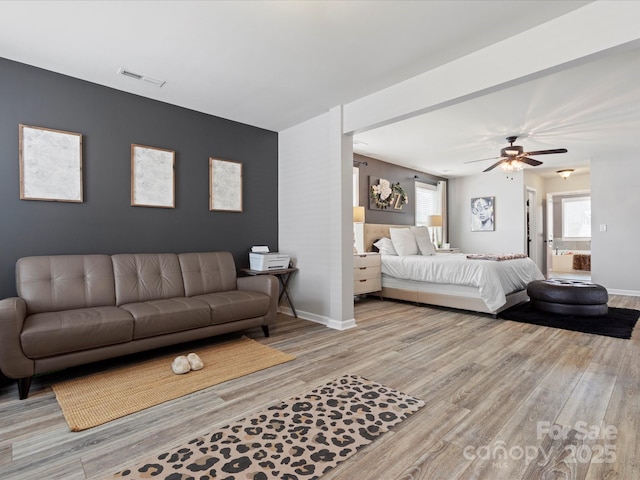 1810 Kerwick Ct, Lancaster, SC 29720 - bedroom with wood finished floors, baseboards, an accent wall, and a ceiling fan