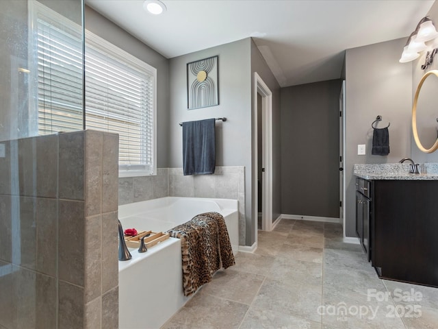 1810 Kerwick Ct, Lancaster, SC 29720 - bathroom with vanity, a garden tub, and baseboards