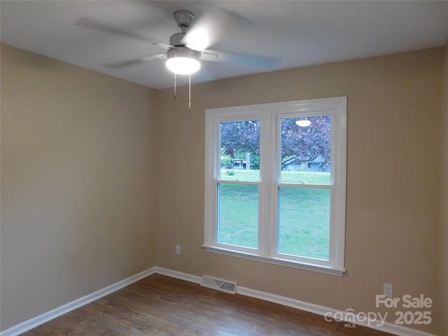 3001 Austin Chaney Rd, Monroe, NC 28110 - spare room with wood finished floors, a ceiling fan, and baseboards