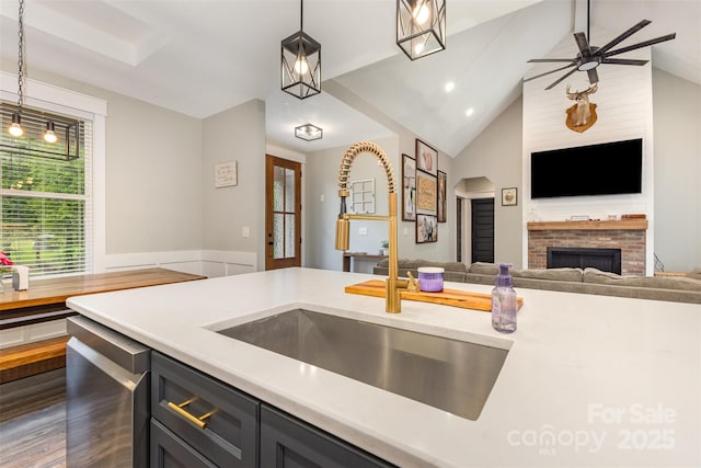 5215 Star Magnolia Ct, Clover, SC 29710 - kitchen featuring a sink, open floor plan, light countertops, a fireplace, and lofted ceiling