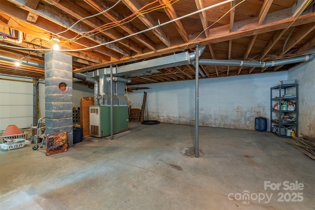 1788 Blue Rock Rd, Burnsville, NC 28714 - unfinished basement with heating unit and concrete block wall
