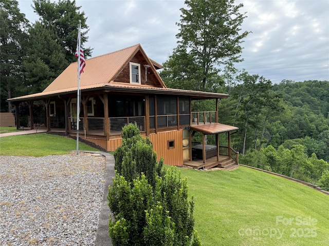 419 Woodpecker Rd, Purlear, NC 28665 - view of home's exterior featuring a lawn, metal roof, and a deck