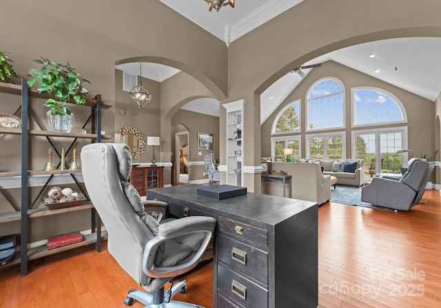 7412 Sahalee Dr, Denver, NC 28037 - office area with arched walkways, high vaulted ceiling, light wood-style flooring, and ornamental molding