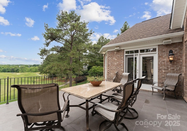 7412 Sahalee Dr, Denver, NC 28037 - view of patio with outdoor dining space and view of wooded area