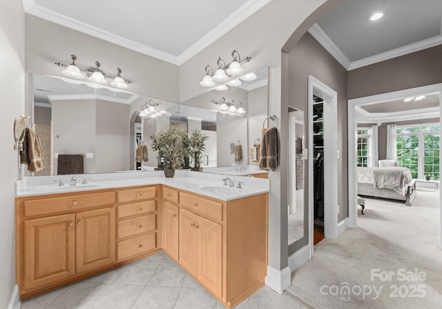 7412 Sahalee Dr, Denver, NC 28037 - bathroom featuring double vanity, crown molding, baseboards, and a walk in closet