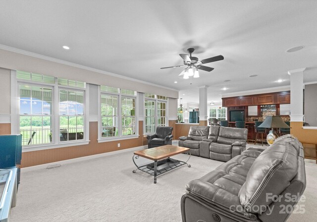 7412 Sahalee Dr, Denver, NC 28037 - living area with crown molding, ornate columns, healthy amount of natural light, light carpet, and recessed lighting