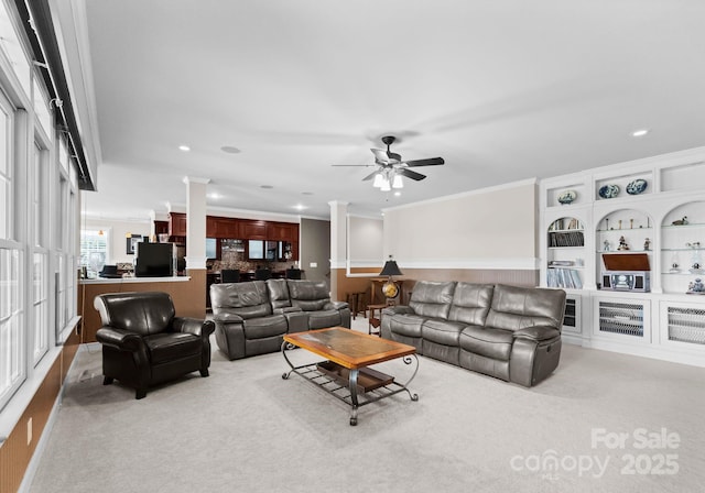 7412 Sahalee Dr, Denver, NC 28037 - carpeted living area with decorative columns, a ceiling fan, ornamental molding, and recessed lighting
