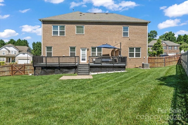 2213 Iron Works Dr, Clover, SC 29710 - rear view of house with a fenced backyard, a deck, and brick siding