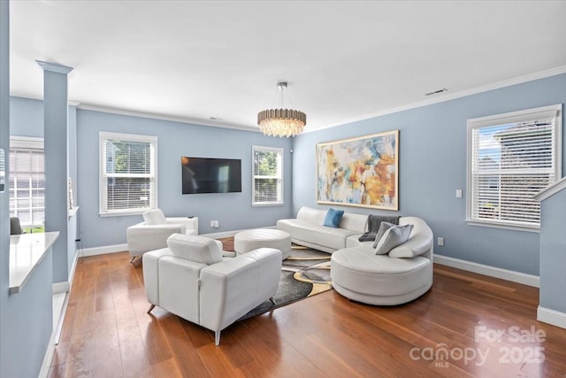 2213 Iron Works Dr, Clover, SC 29710 - living room with wood-type flooring, crown molding, and a chandelier