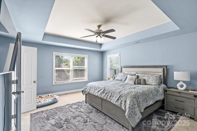 2213 Iron Works Dr, Clover, SC 29710 - bedroom featuring a tray ceiling, carpet, and a ceiling fan