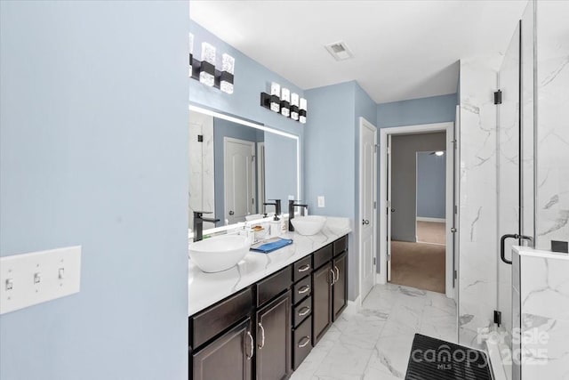 2213 Iron Works Dr, Clover, SC 29710 - full bath featuring marble look tile flooring, a marble finish shower, and double vanity