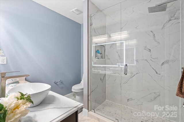 2213 Iron Works Dr, Clover, SC 29710 - bathroom featuring a marble finish shower and vanity