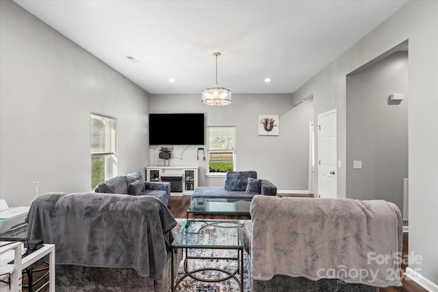 85 Ruritan Park Rd, Stony Point, NC 28678 - living room with healthy amount of natural light, dark wood-style flooring, recessed lighting, baseboards, and a chandelier
