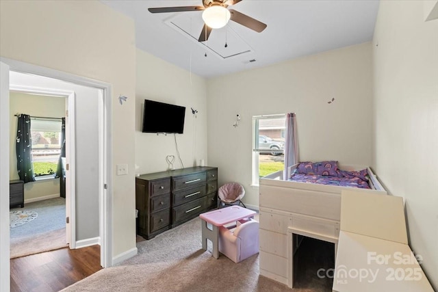 85 Ruritan Park Rd, Stony Point, NC 28678 - carpeted bedroom featuring attic access, baseboards, wood finished floors, and a ceiling fan