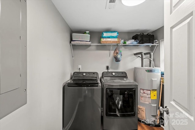 85 Ruritan Park Rd, Stony Point, NC 28678 - laundry area featuring water heater, washing machine and clothes dryer, and wood finished floors