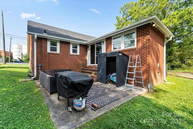 85 Ruritan Park Rd, Stony Point, NC 28678 - back of house featuring brick siding and a lawn
