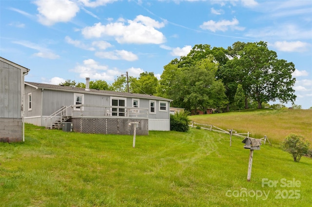 112 Melody St, Clyde, NC 28721 - rear view of property with a yard, a deck, and cooling unit