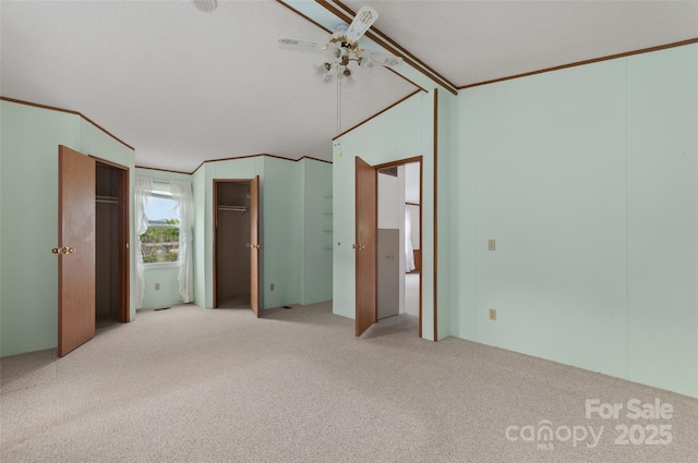 112 Melody St, Clyde, NC 28721 - unfurnished bedroom featuring carpet floors, crown molding, and two closets