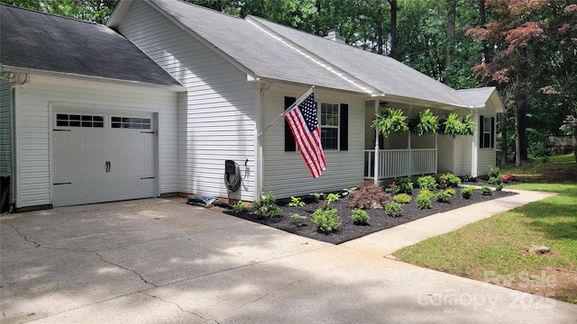 109 Pepper Cir, Mooresville, NC 28117 - view of side of property with a garage, roof with shingles, concrete driveway, covered porch, and a chimney