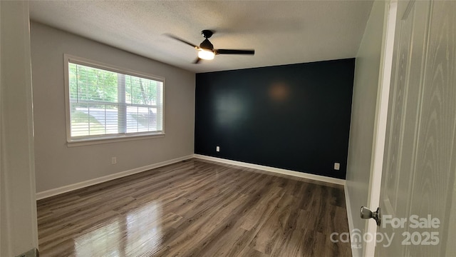 109 Pepper Cir, Mooresville, NC 28117 - unfurnished room with wood finished floors, a ceiling fan, baseboards, and a textured ceiling