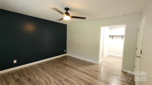 109 Pepper Cir, Mooresville, NC 28117 - unfurnished room featuring a ceiling fan, wood finished floors, baseboards, and a smoke detector