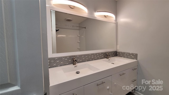 109 Pepper Cir, Mooresville, NC 28117 - bathroom with double vanity and decorative backsplash
