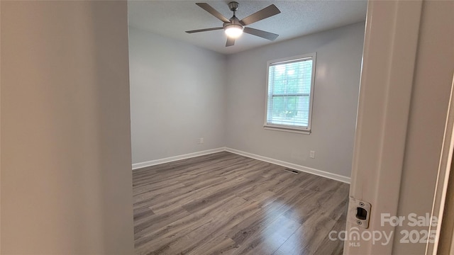 109 Pepper Cir, Mooresville, NC 28117 - empty room with dark wood-style floors, baseboards, and ceiling fan