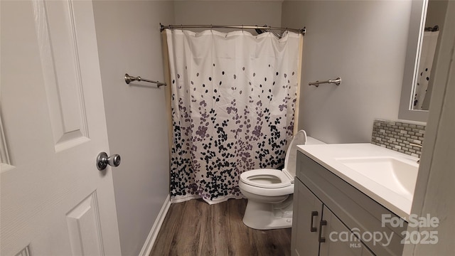 109 Pepper Cir, Mooresville, NC 28117 - bathroom featuring wood finished floors, toilet, vanity, tasteful backsplash, and curtained shower