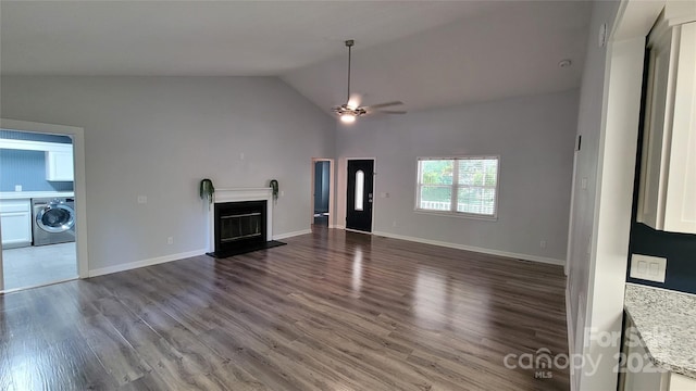 109 Pepper Cir, Mooresville, NC 28117 - unfurnished living room with washer / dryer, ceiling fan, lofted ceiling, a fireplace with flush hearth, and dark wood-style flooring