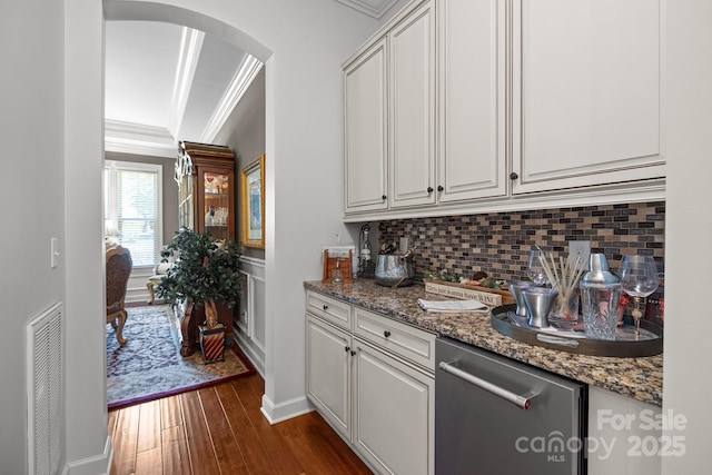 3009 Botetourt Ct, Weddington, NC 28104 - kitchen featuring arched walkways, crown molding, dark wood-style flooring, decorative backsplash, and white cabinets