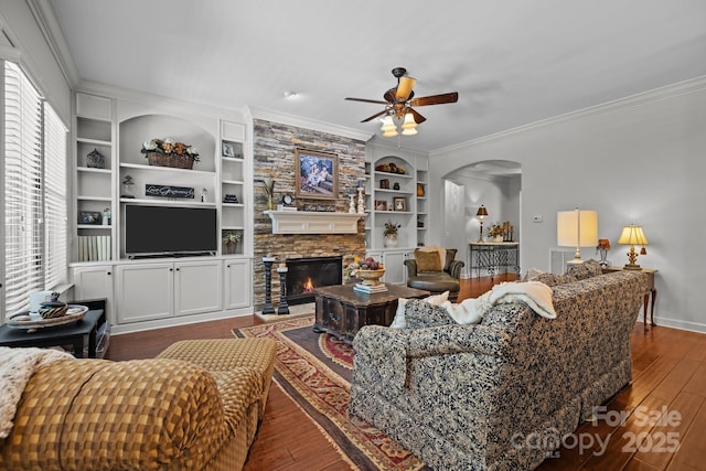 3009 Botetourt Ct, Weddington, NC 28104 - living area featuring ceiling fan, arched walkways, ornamental molding, wood-type flooring, and built in shelves