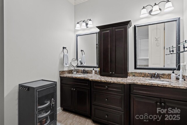 3009 Botetourt Ct, Weddington, NC 28104 - bathroom featuring double vanity and ornamental molding