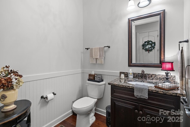 3009 Botetourt Ct, Weddington, NC 28104 - bathroom with a wainscoted wall, vanity, and wood finished floors