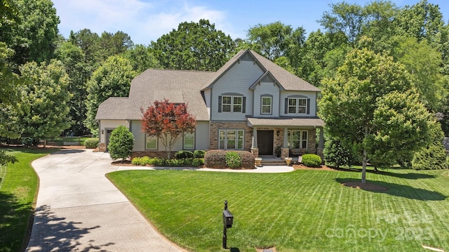 3009 Botetourt Ct, Weddington, NC 28104 - craftsman house with concrete driveway, a front lawn, stone siding, an attached garage, and roof with shingles
