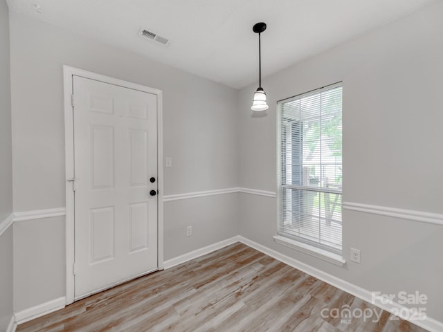 10736 Spruce Mountain Rd, Charlotte, NC 28214 - unfurnished room with light wood-style floors and baseboards
