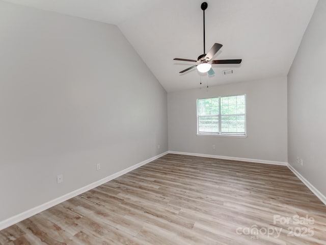 10736 Spruce Mountain Rd, Charlotte, NC 28214 - unfurnished room featuring vaulted ceiling, light wood-type flooring, ceiling fan, and baseboards