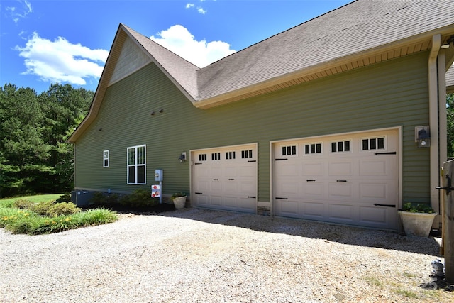 114 Wingard Rd, Concord, NC 28025 - view of property exterior with driveway, a shingled roof, and a garage