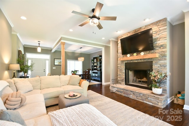 114 Wingard Rd, Concord, NC 28025 - living area featuring ceiling fan, wood finished floors, crown molding, a fireplace, and baseboards