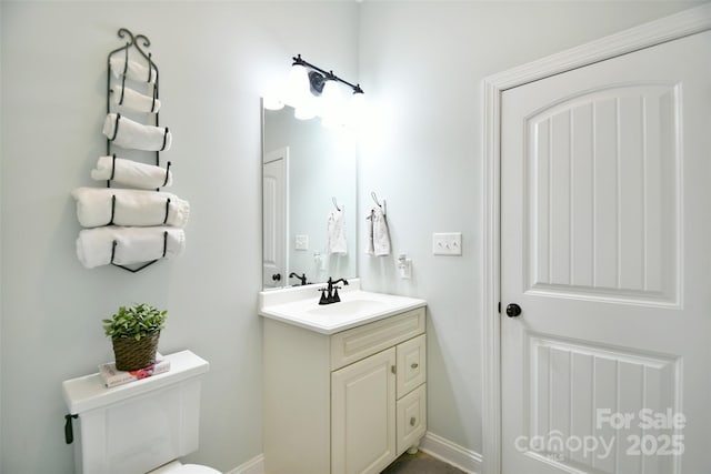 114 Wingard Rd, Concord, NC 28025 - bathroom featuring vanity, toilet, and baseboards