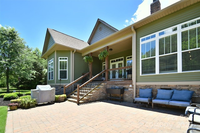 114 Wingard Rd, Concord, NC 28025 - covered porch featuring a patio and an outdoor hangout area